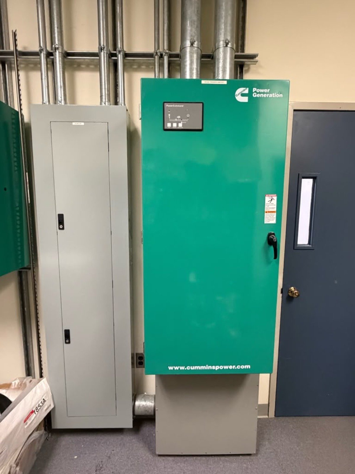 Cummins automatic transfer switch installed beside the main distribution panel